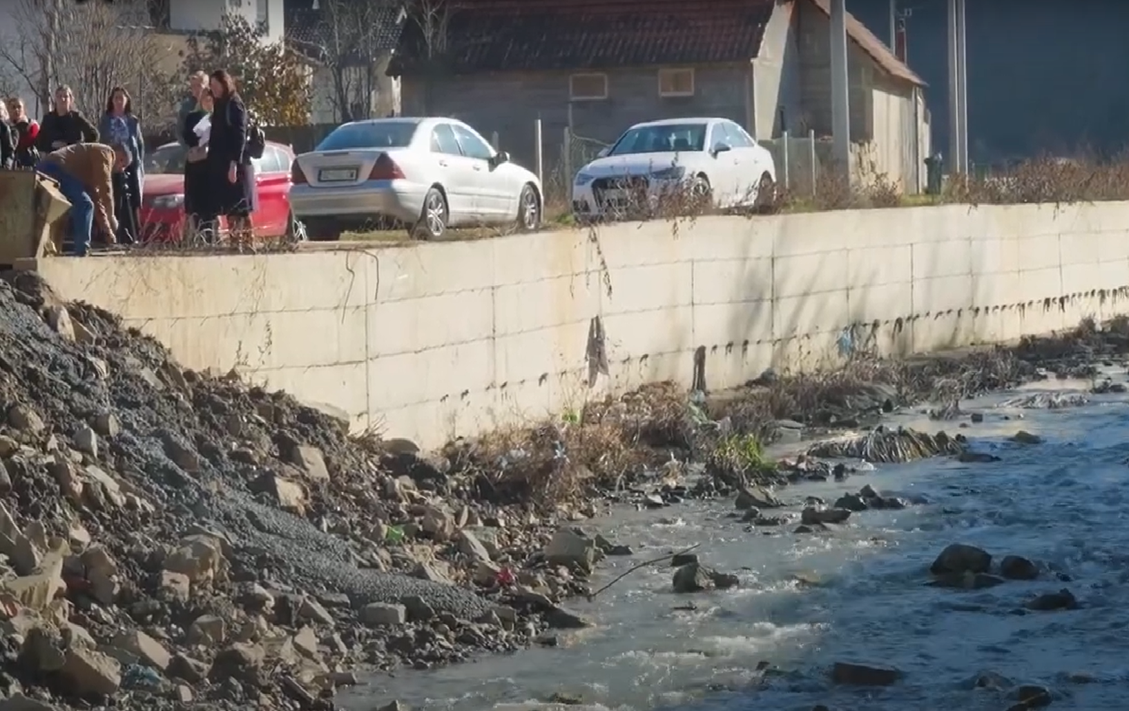 Citizens of Skenderaj monitor construction works on the Klina River protective wall
